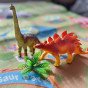 WOOPIE Dinozaurų figūrėlių rinkinys 16 vnt. + Kilimas + Skrynėlė